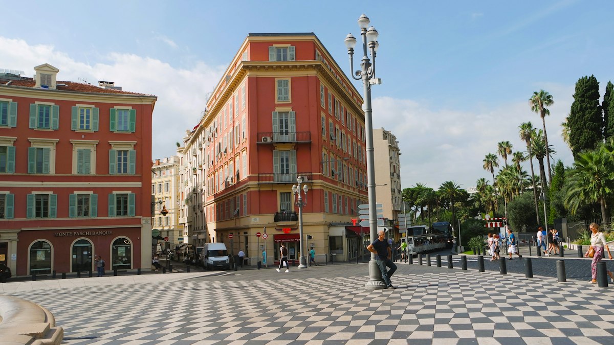 Place Masséna, its red façades and chequered pavement